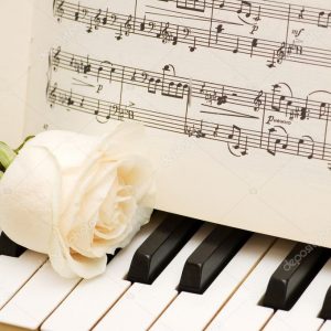depositphotos_2604083-stock-photo-romantic-concept-rose-on-piano
